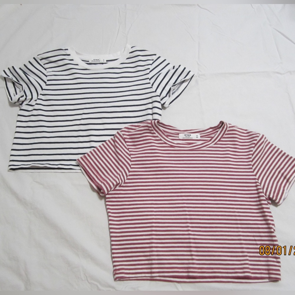 Two Cotton On stripped cropped t-shirts.